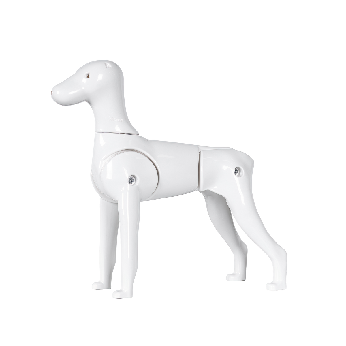 A white plastic model of a Schnauzer dog with moveable tail and legs.